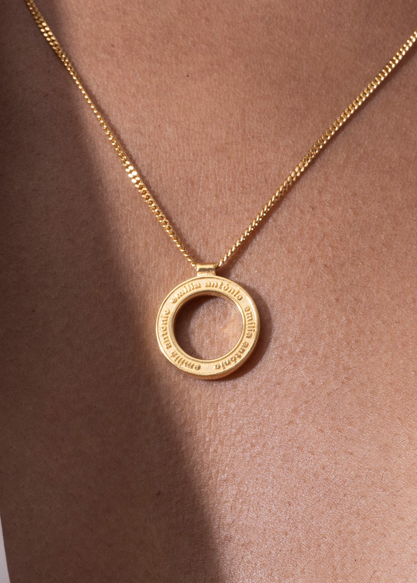 personalized engraving necklace selection featuring a gold pendant with intricate engravings