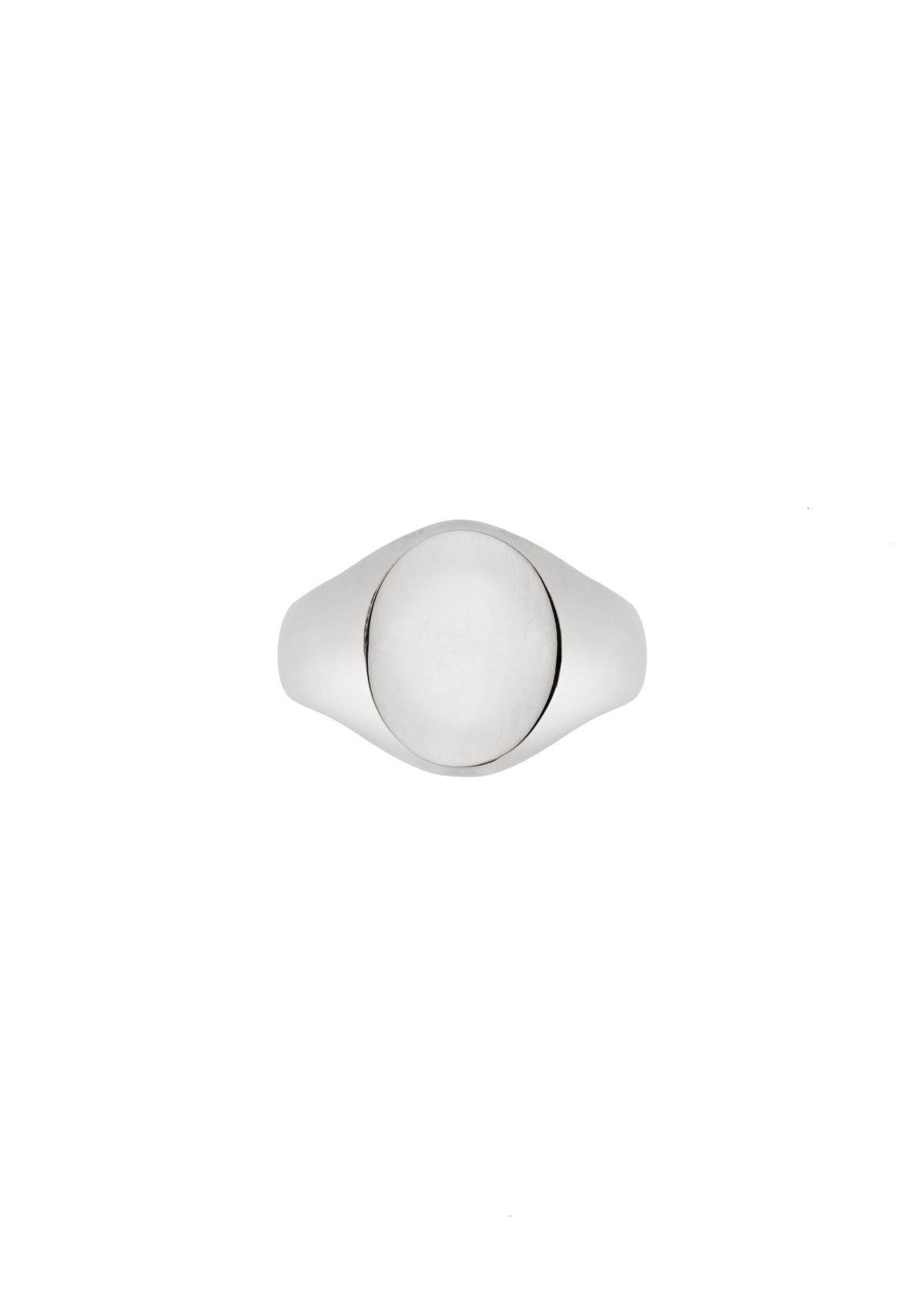 A silver signet ring with a smooth, polished oval face, photographed from directly above on a solid white background.