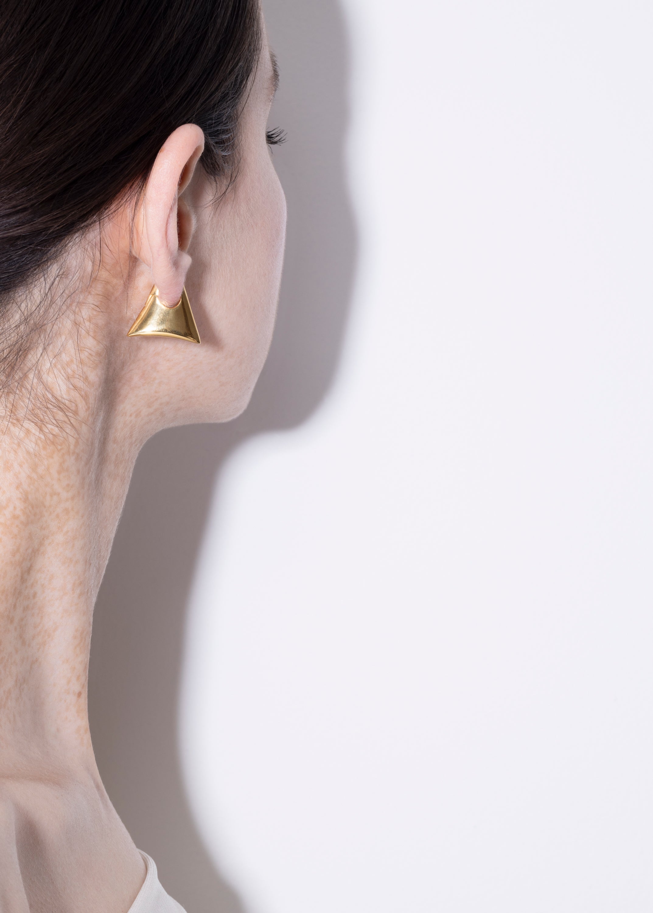 model wearing blake earrings in gold