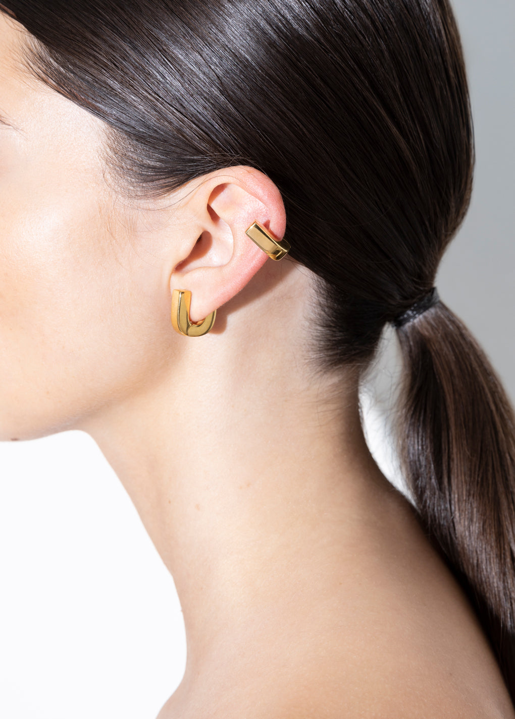 model wearing fiona huggies in gold