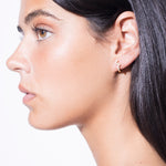 model wearing diamond dancing huggies 18k