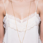 model wearing bottle long 18k necklace