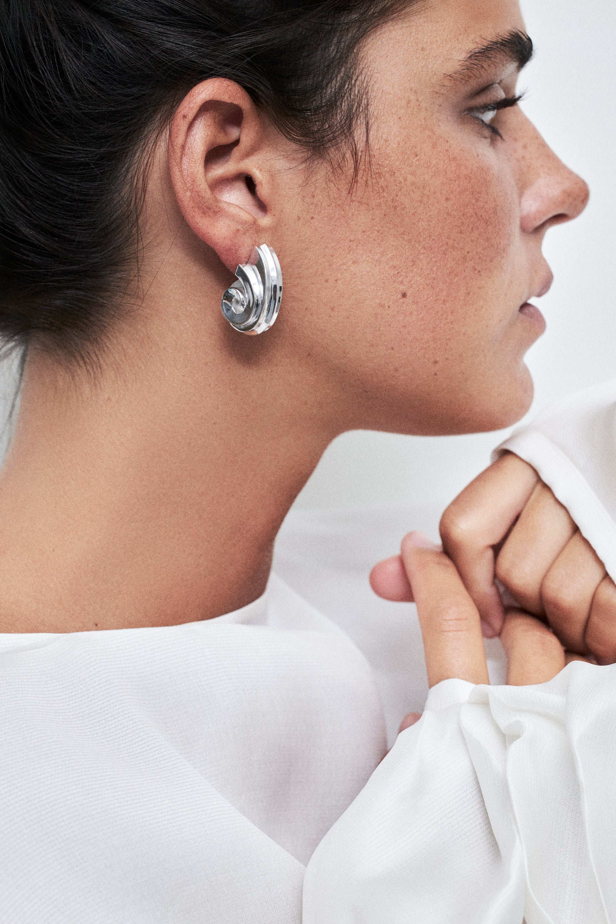 model wearing sia earrings ins silver