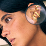 model wearing charli earcuff and bella earcuff in gold