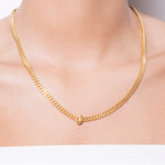 model wearing alphabet necklace with pendant J in gold