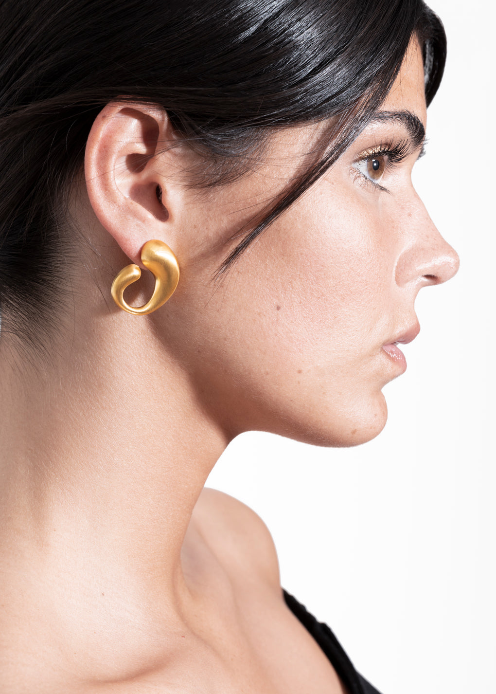 model wearing camille earrings in gold