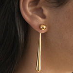 model wearing sade earrings in gold