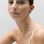 model wearing fiona huggies, elin necklace and bao huggies in gold