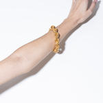 model wearing goliath bracelet in gold