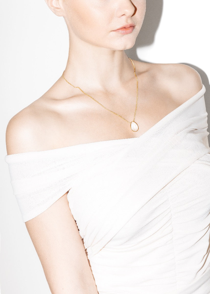 model wearing klein necklace in gold