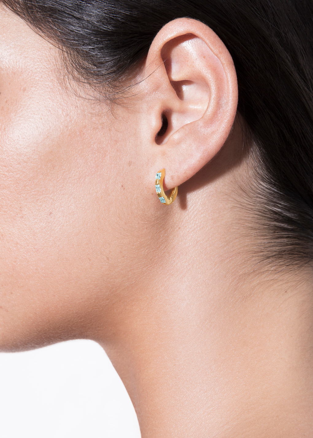 model wearing norma earrings turquoise in gold