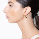 model wearing rosie earrings in gold