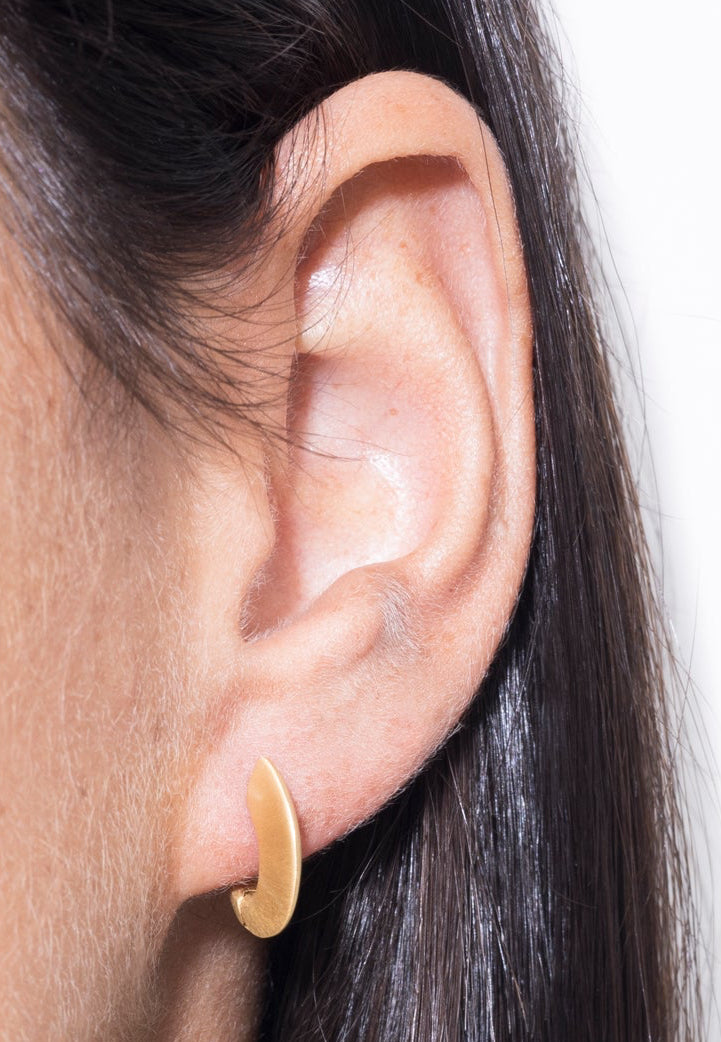 model wearing sarah mini earrings in gold