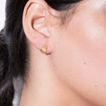 model wearing tilly earrings in gold