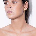 model wearing tilly earrings in gold