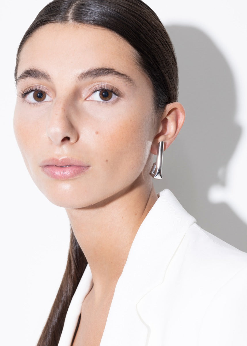 model wearing tina earrings in silver